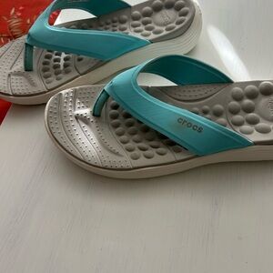 CROCS Women's Teal and White Sandal shows offer no ship label created